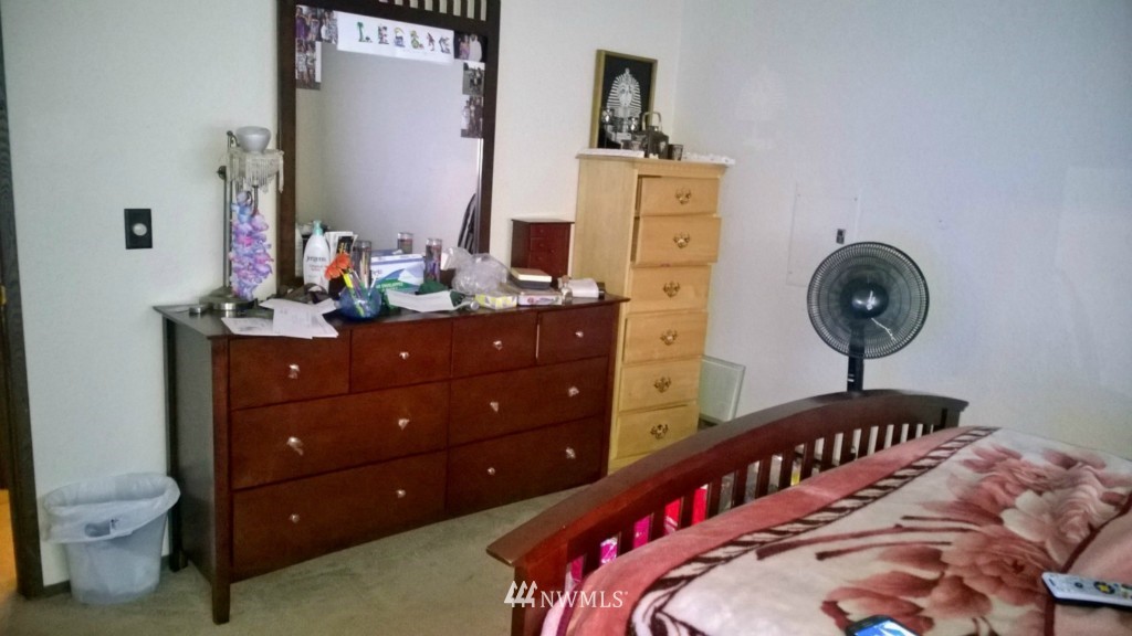516 Smithers Avenue South Renton, WA 98057 - Photo 14 of 23 a bedroom with a bed and a dresser