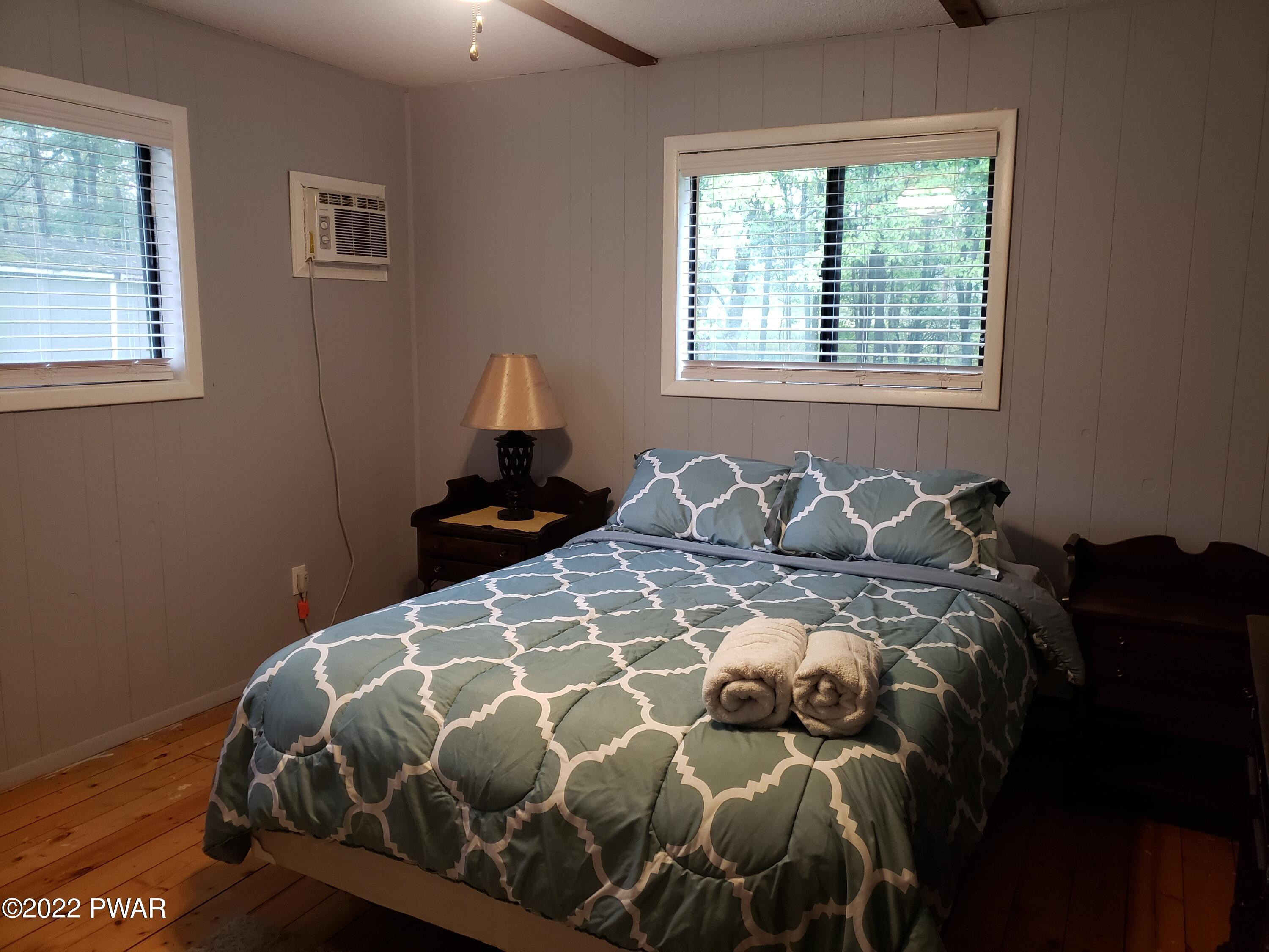 40 Crest View Road Lake Ariel, PA 18436 - Photo 4 of 32 a bedroom with a bed and wooden floor
