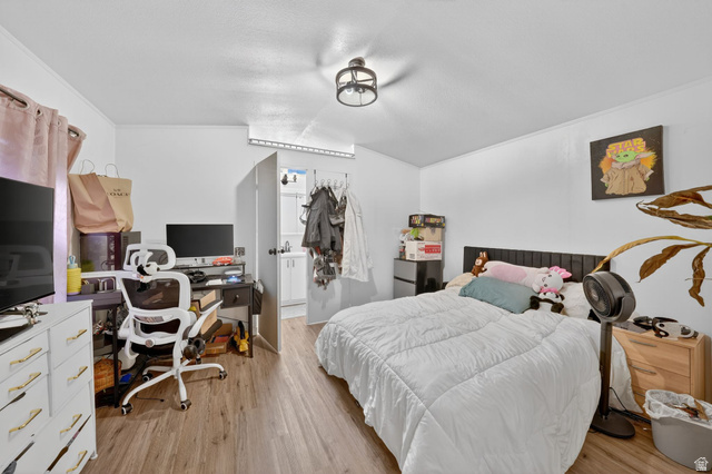262 Hidden View Drive, Unit 94 Sandy, UT 84070 - Photo 9 of 18 Bedroom with a desk, light wood finished floors, lofted ceiling, and freestanding refrigerator