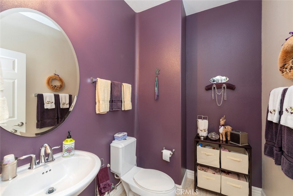 227 Tom McGuinness Jr Circle Fallbrook, CA 92028 - Photo 18 of 42 a bathroom with a sink mirror and toilet
