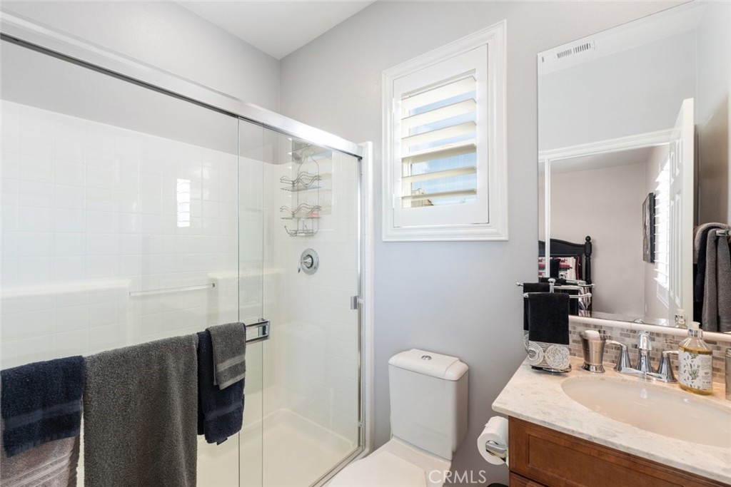 227 Tom McGuinness Jr Circle Fallbrook, CA 92028 - Photo 20 of 42 a bathroom with a sink toilet and shower