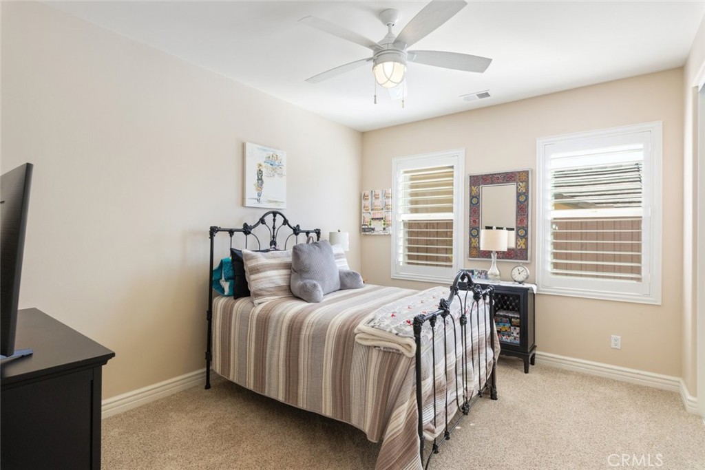 227 Tom McGuinness Jr Circle Fallbrook, CA 92028 - Photo 21 of 42 a bedroom with a bed and a window