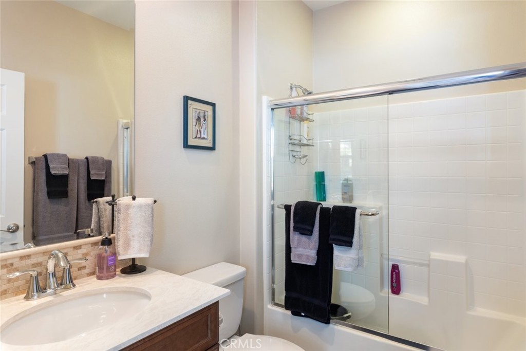 227 Tom McGuinness Jr Circle Fallbrook, CA 92028 - Photo 29 of 42 a bathroom with a sink vanity mirror and shower