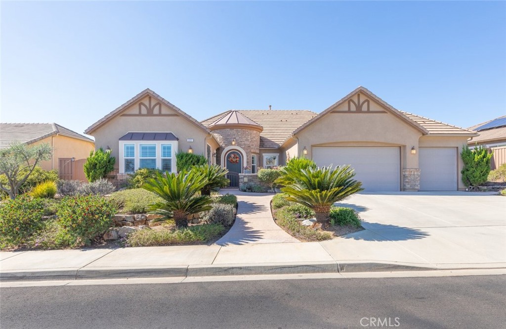 227 Tom McGuinness Jr Circle Fallbrook, CA 92028 - Photo 3 of 42 a white house with a large yard and plants