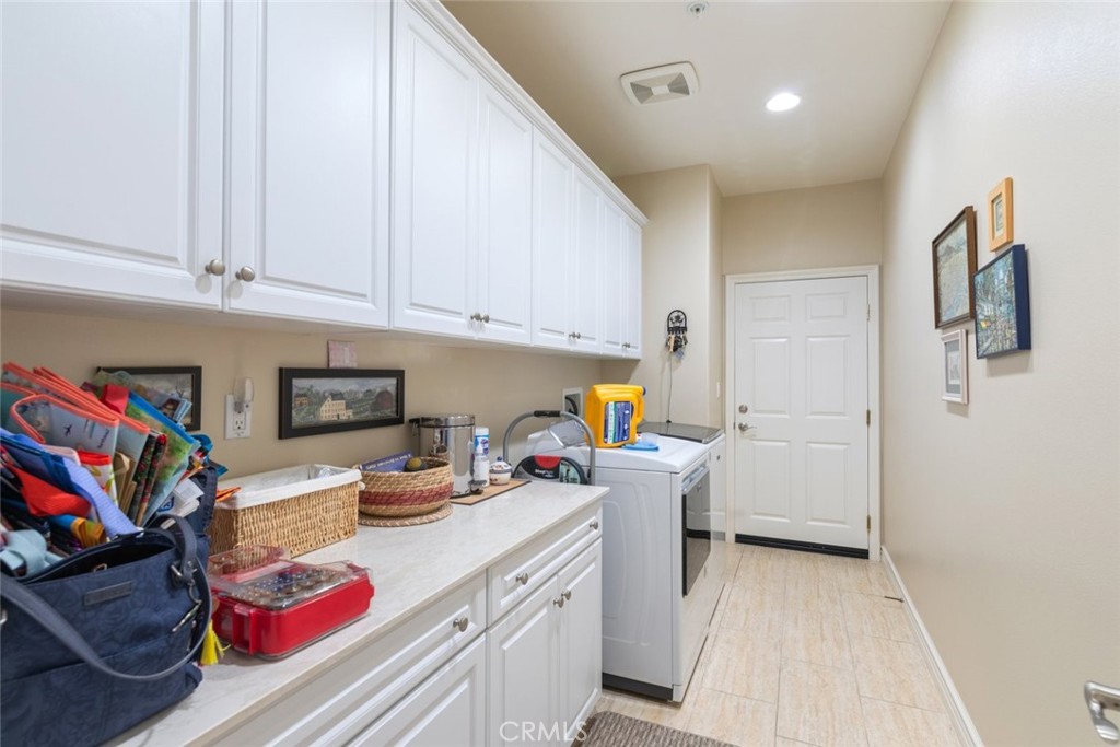 227 Tom McGuinness Jr Circle Fallbrook, CA 92028 - Photo 32 of 42 a kitchen with a sink and cabinets