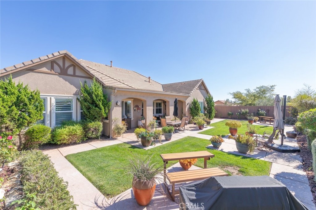 227 Tom McGuinness Jr Circle Fallbrook, CA 92028 - Photo 41 of 42 a view of a house with backyard sitting area and garden