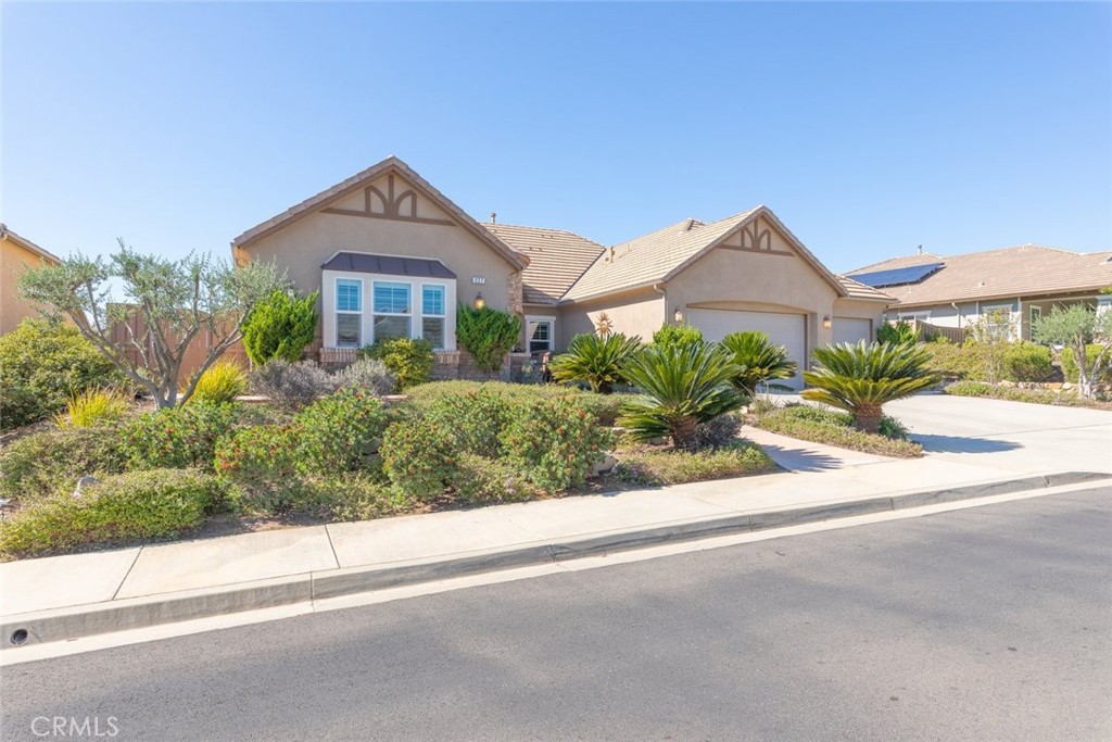 227 Tom McGuinness Jr Circle Fallbrook, CA 92028 - Photo 42 of 42 a front view of a house with a yard and garage
