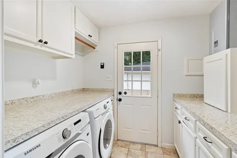 a bathroom with a sink a toilet and shower curtain