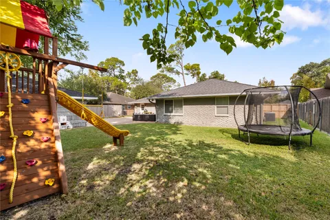 a view of a backyard with a slide