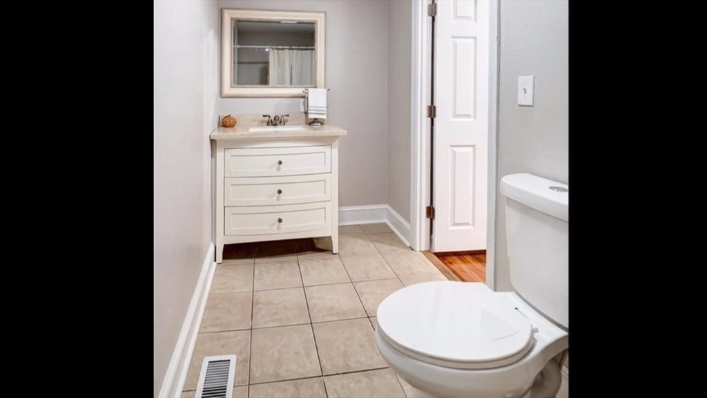 2 C Street Douglas, MA 01516 - Photo 19 of 27 a bathroom with a toilet a sink and mirror