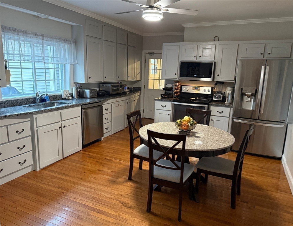 2 C Street Douglas, MA 01516 - Photo 10 of 27 a kitchen with a dining table chairs and refrigerator