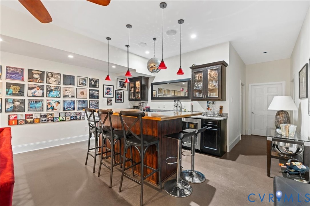 3308 Yarding Way Toano, VA 23168 - Photo 76 of 83 a dining area with a table chairs and a kitchen view