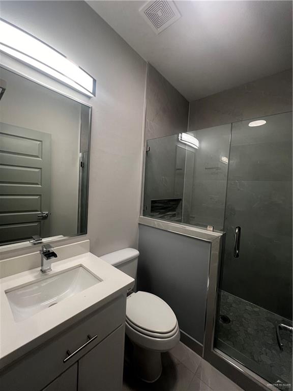 2204 North Jackson Road, Unit A C F Edinburg, TX 78541 - Photo 14 of 18 a bathroom with a sink toilet and shower