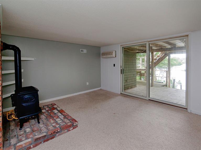 288 Huckins Neck Road Centerville, MA 02601 - Photo 13 of 18 a view of a livingroom with wooden floor and a cabinet