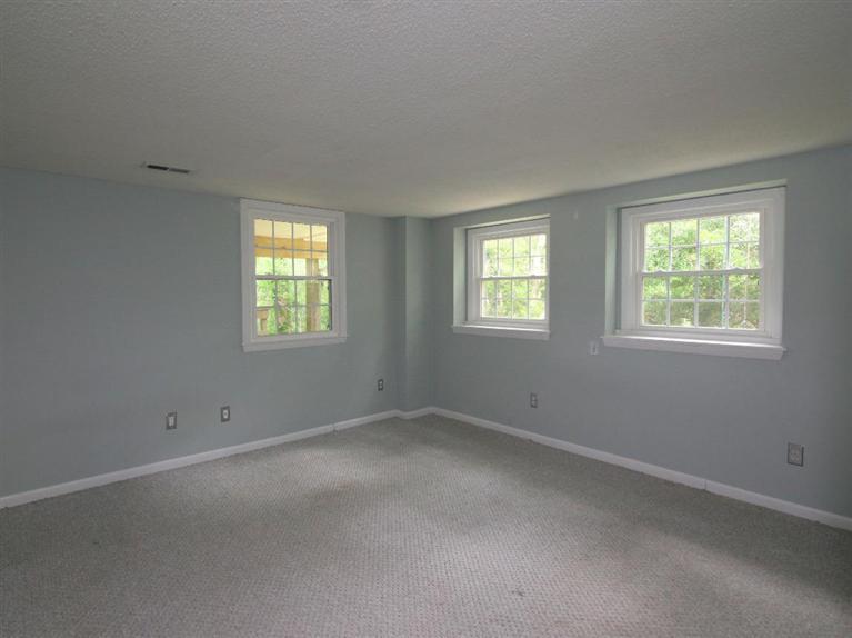 288 Huckins Neck Road Centerville, MA 02601 - Photo 14 of 18 an empty room with windows