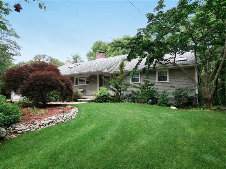 288 Huckins Neck Road Centerville, MA 02601 - Photo 2 of 18 a view of a house with a yard