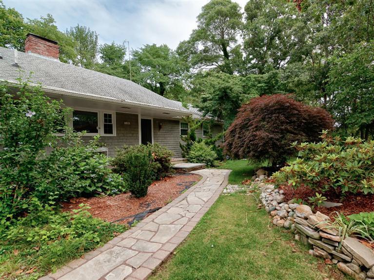 288 Huckins Neck Road Centerville, MA 02601 - Photo 4 of 18 a view of a house with a yard and plants