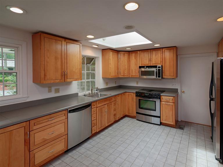 288 Huckins Neck Road Centerville, MA 02601 - Photo 6 of 18 a kitchen with stainless steel appliances granite countertop a sink and a stove