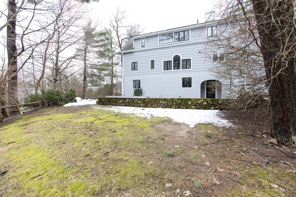 50 Lincoln Road Wellesley, MA 02481 - Photo 13 of 16 a white house that has a tree in front of it