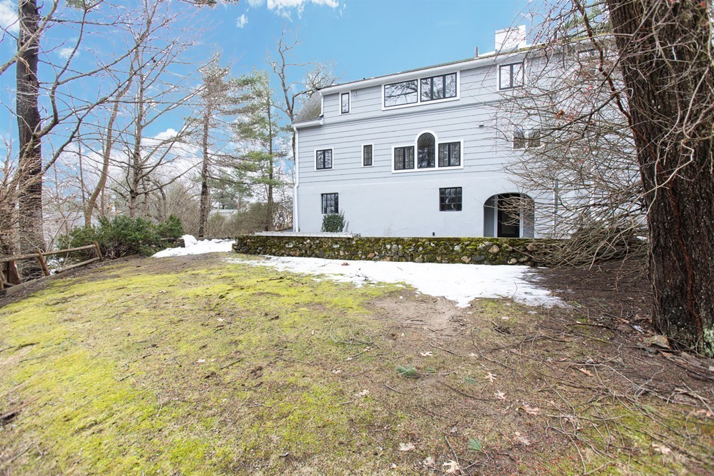50 Lincoln Road Wellesley, MA 02481 - Photo 16 of 16 a white house that has a tree in front of it