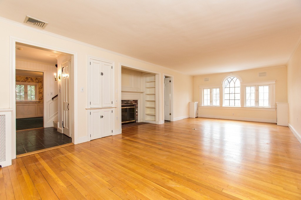 50 Lincoln Road Wellesley, MA 02481 - Photo 4 of 16 wooden floor in an empty room with a window