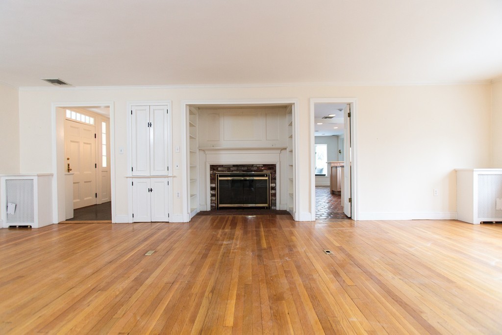50 Lincoln Road Wellesley, MA 02481 - Photo 5 of 16 a view of a livingroom with wooden floor and kitchen space