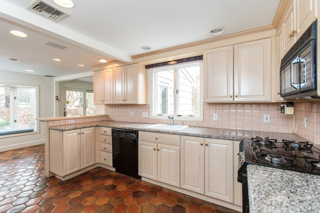 50 Lincoln Road Wellesley, MA 02481 - Photo 7 of 16 a kitchen with sink cabinets and window