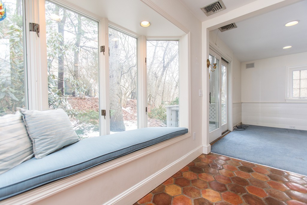 50 Lincoln Road Wellesley, MA 02481 - Photo 9 of 16 a living room with furniture and large windows