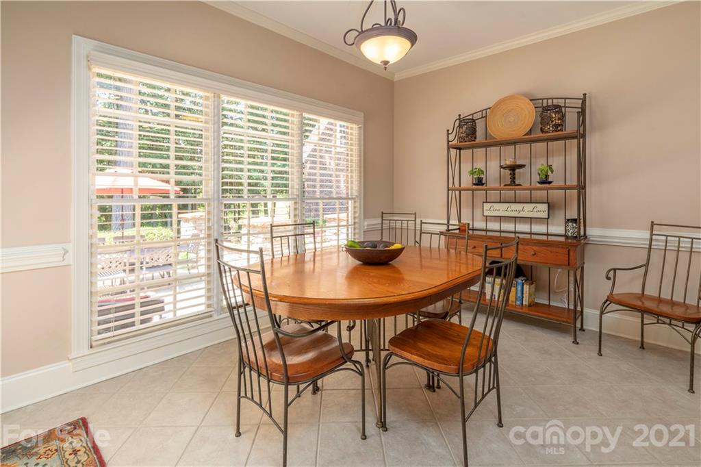 6607 Fox Ridge Circle Davidson, NC 28036 - Photo 15 of 48 a view of a dining room with furniture and a large window