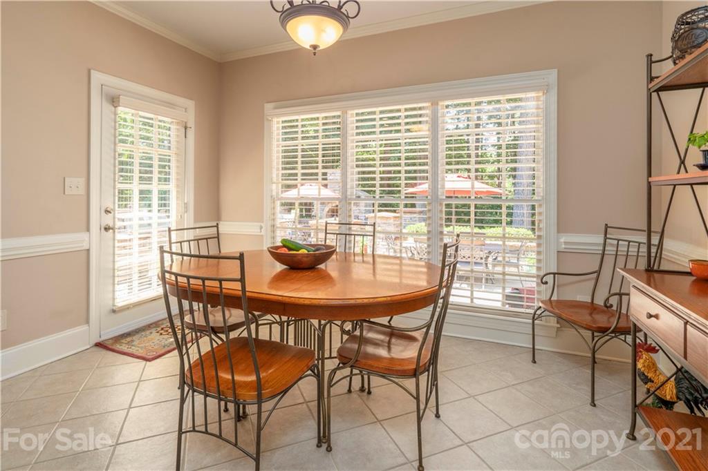 6607 Fox Ridge Circle Davidson, NC 28036 - Photo 16 of 48 a view of a dining room with furniture and a potted plant