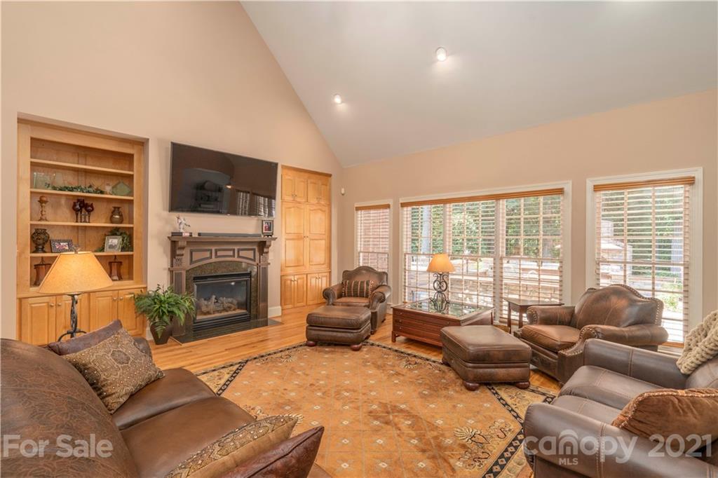 6607 Fox Ridge Circle Davidson, NC 28036 - Photo 17 of 48 a living room with furniture large window and a fireplace