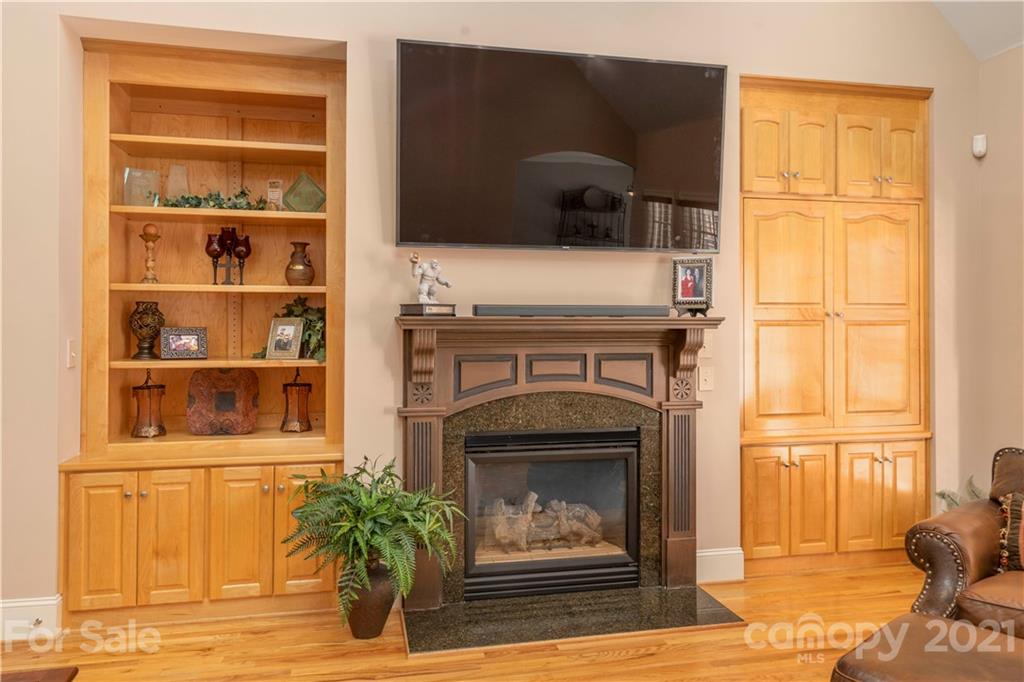 6607 Fox Ridge Circle Davidson, NC 28036 - Photo 18 of 48 a living room with a fireplace and a window