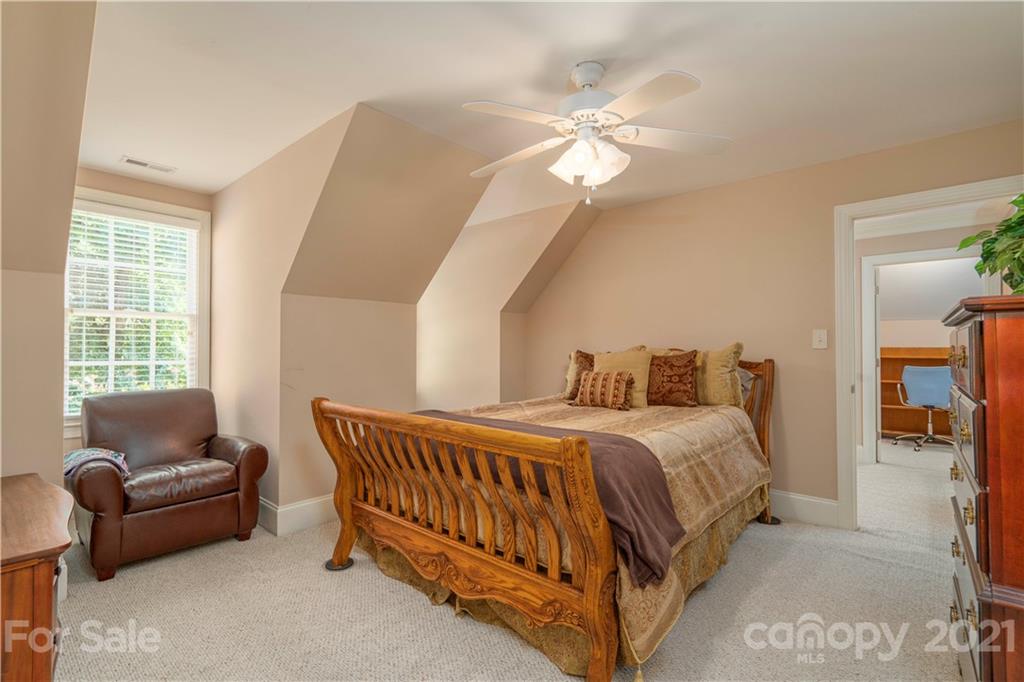 6607 Fox Ridge Circle Davidson, NC 28036 - Photo 29 of 48 a bedroom with a bed and a couch