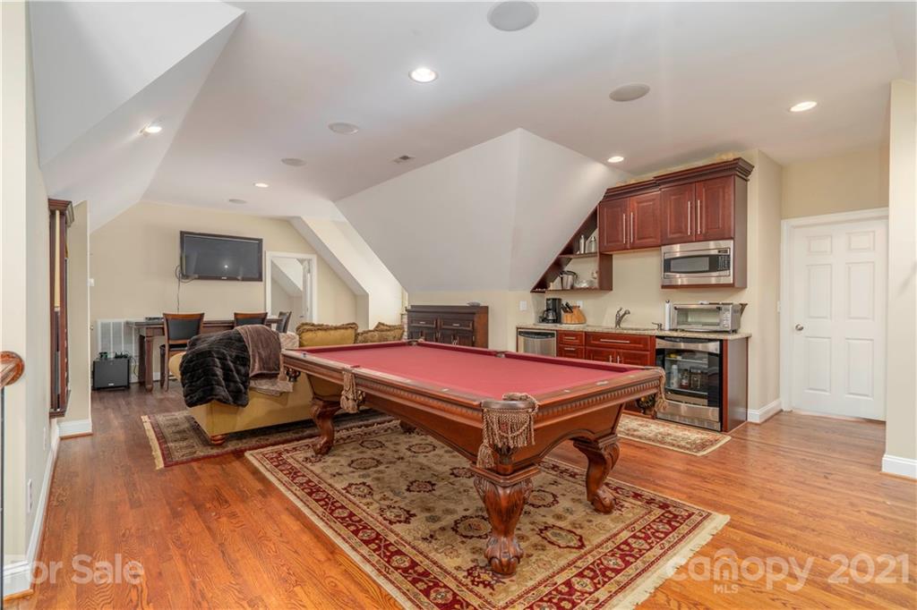6607 Fox Ridge Circle Davidson, NC 28036 - Photo 32 of 48 a living room with a table tennis pool table and chairs