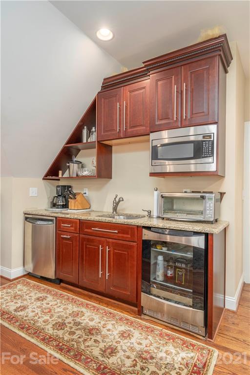 6607 Fox Ridge Circle Davidson, NC 28036 - Photo 36 of 48 a kitchen with stainless steel appliances granite countertop a stove and cabinets
