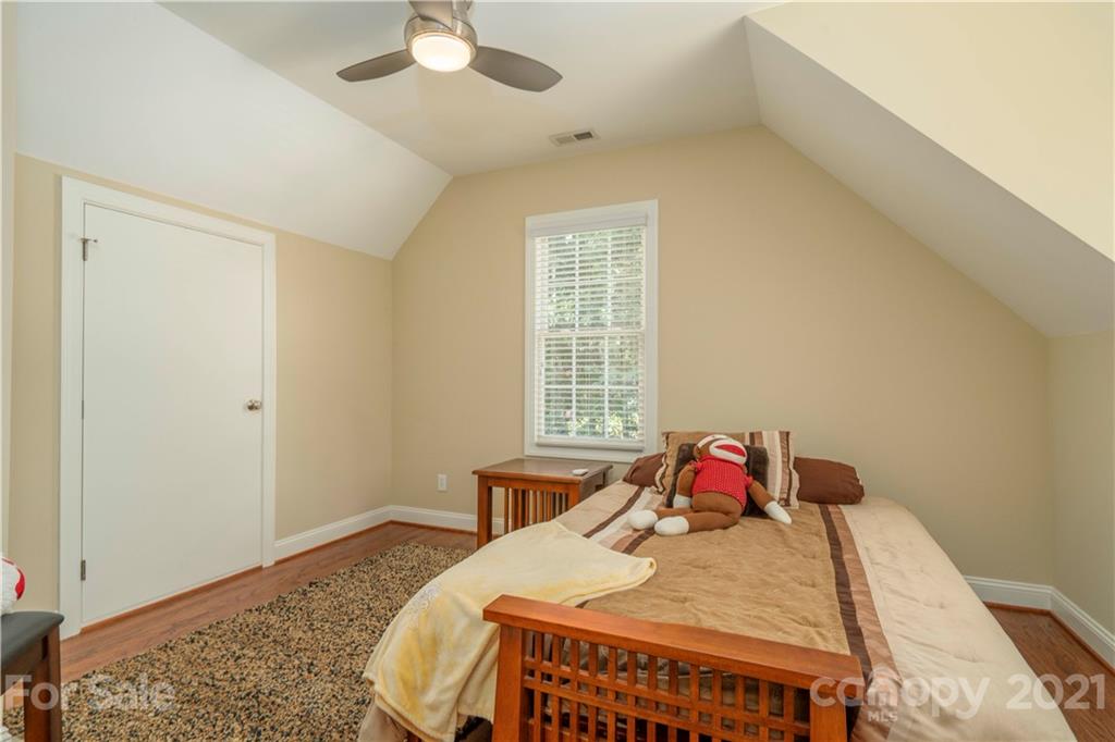 6607 Fox Ridge Circle Davidson, NC 28036 - Photo 40 of 48 a bed sitting in a bedroom next to a window