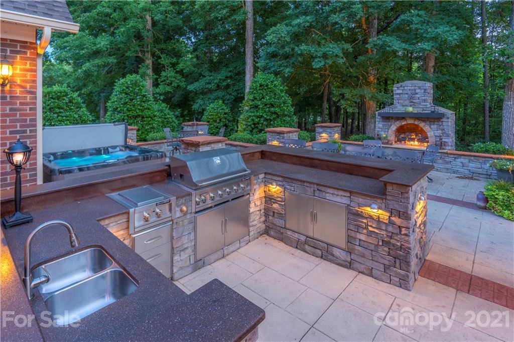 6607 Fox Ridge Circle Davidson, NC 28036 - Photo 45 of 48 an outdoor sitting area with a fireplace