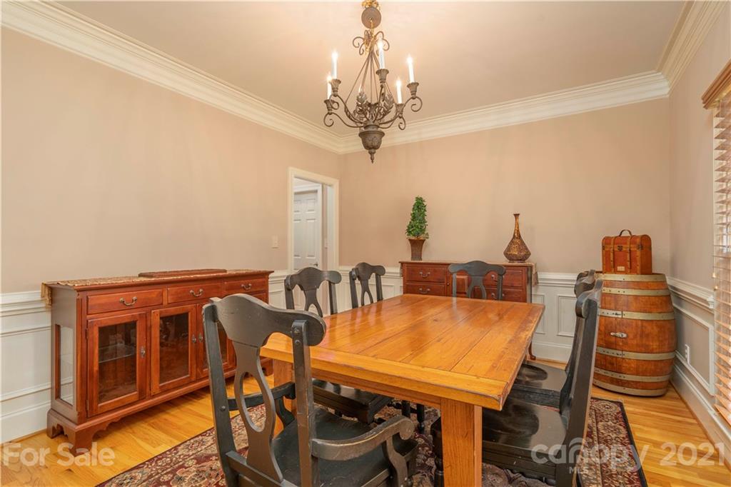 6607 Fox Ridge Circle Davidson, NC 28036 - Photo 7 of 48 a view of a dining room with furniture and chandelier