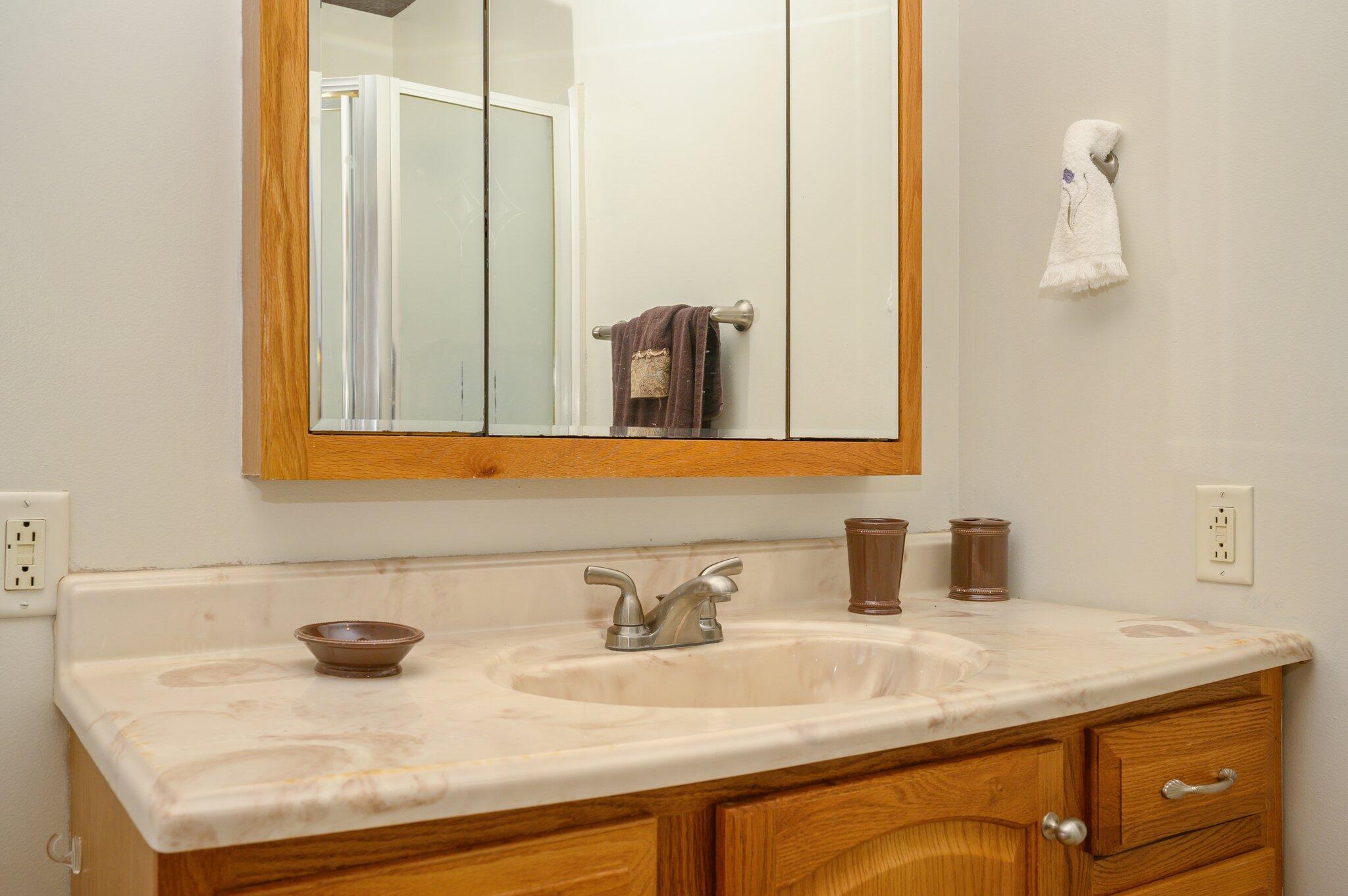 52 Tulip Avenue DeFuniak Springs, FL 32433 - Photo 12 of 34 a bathroom with a sink and a mirror