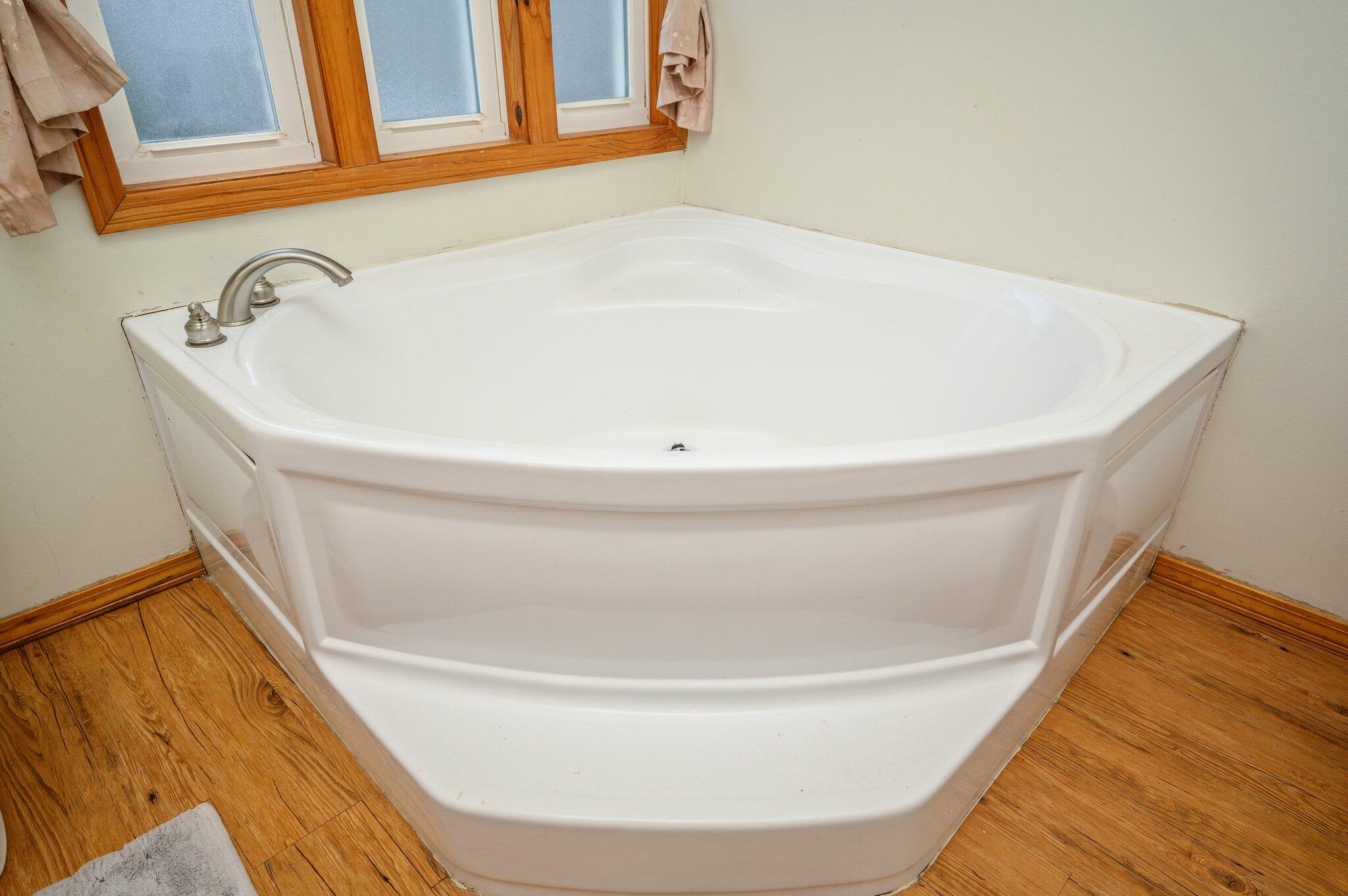 52 Tulip Avenue DeFuniak Springs, FL 32433 - Photo 13 of 34 a white bath tub sitting in a bathroom
