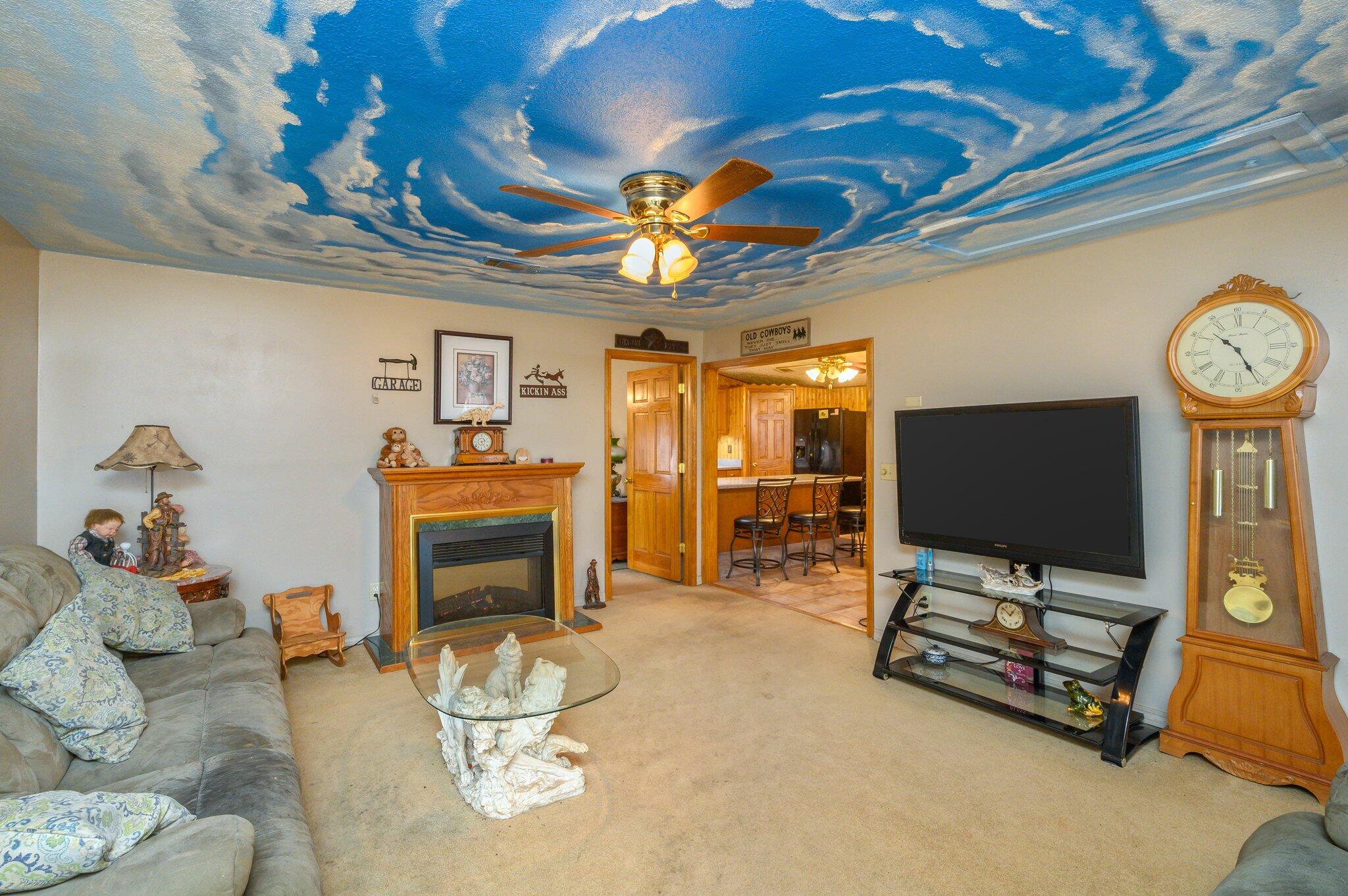 52 Tulip Avenue DeFuniak Springs, FL 32433 - Photo 28 of 34 a living room with furniture a flat screen tv and a fireplace