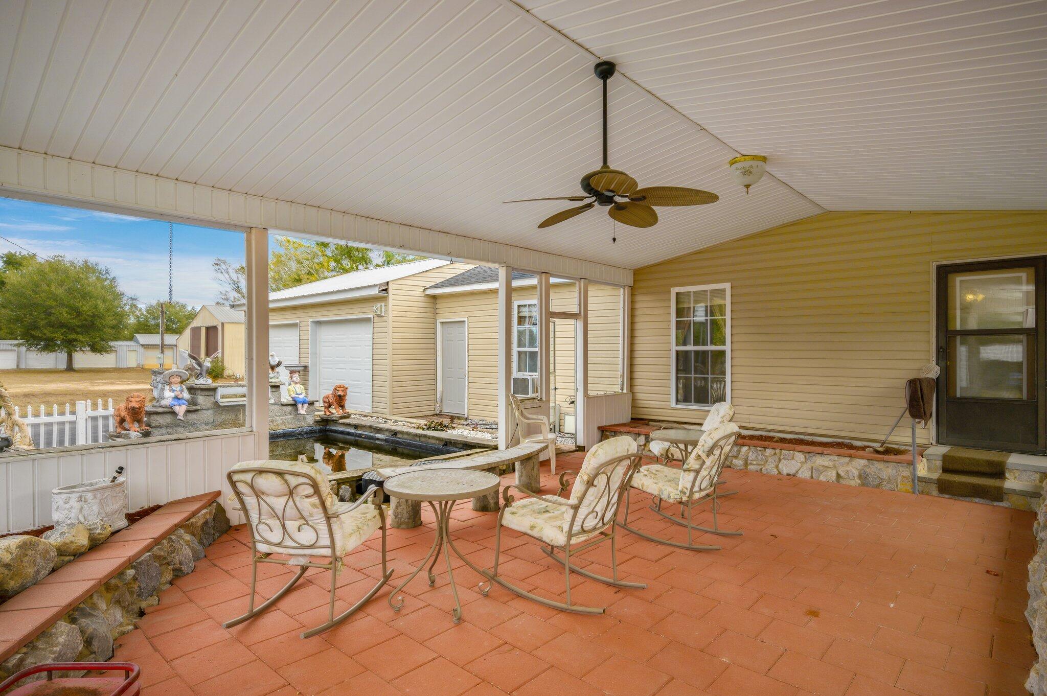 52 Tulip Avenue DeFuniak Springs, FL 32433 - Photo 29 of 34 a room with lots of chairs and mirrors