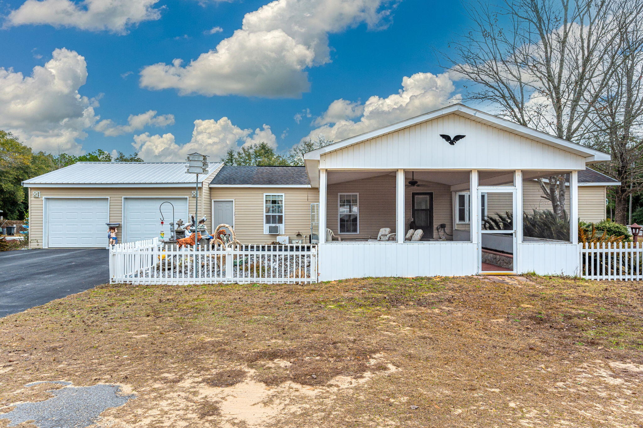 52 Tulip Avenue DeFuniak Springs, FL 32433 - Photo 33 of 34 a view of house with a big yard and large tree