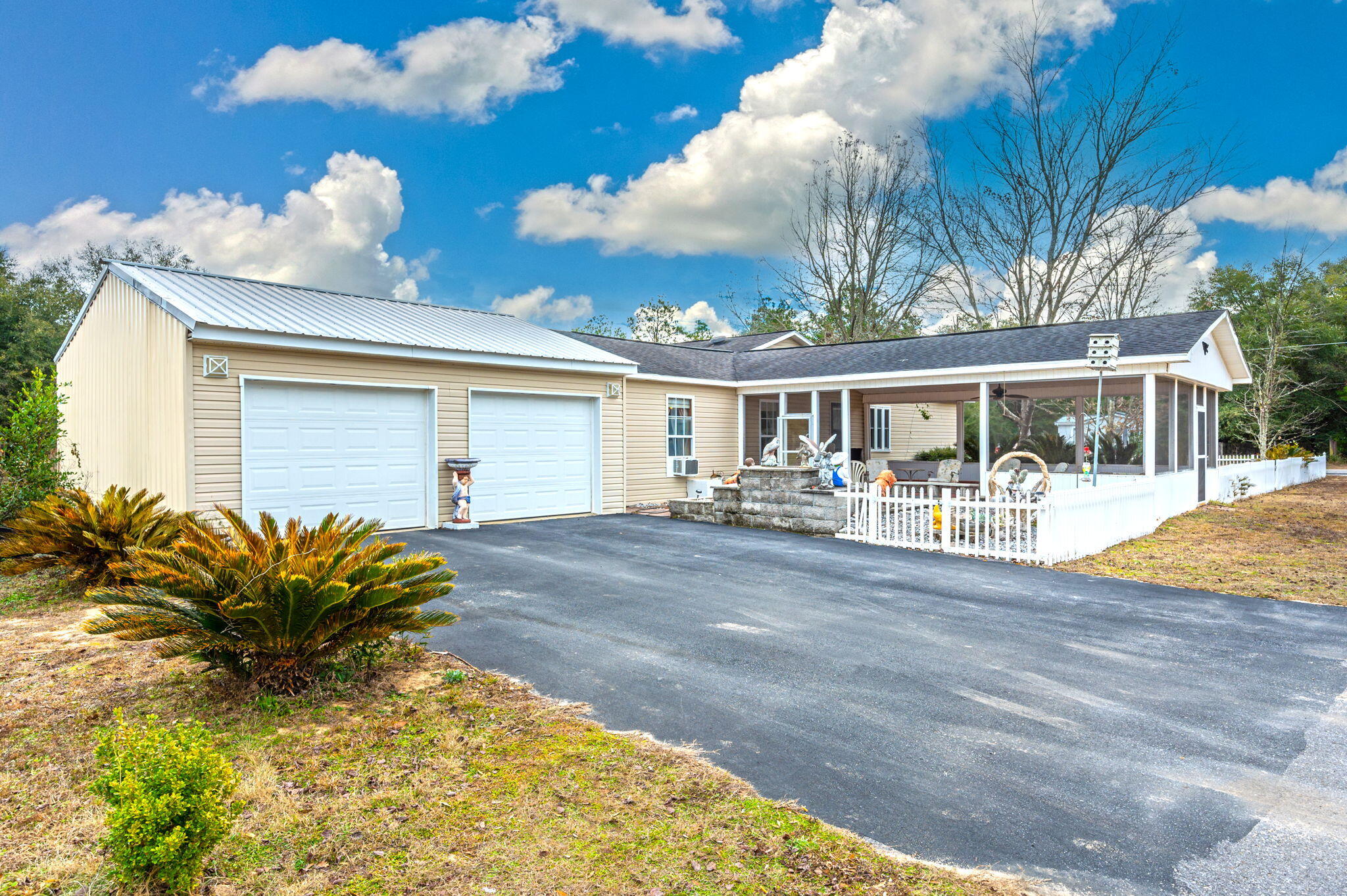 52 Tulip Avenue DeFuniak Springs, FL 32433 - Photo 34 of 34 a front view of a house with garden