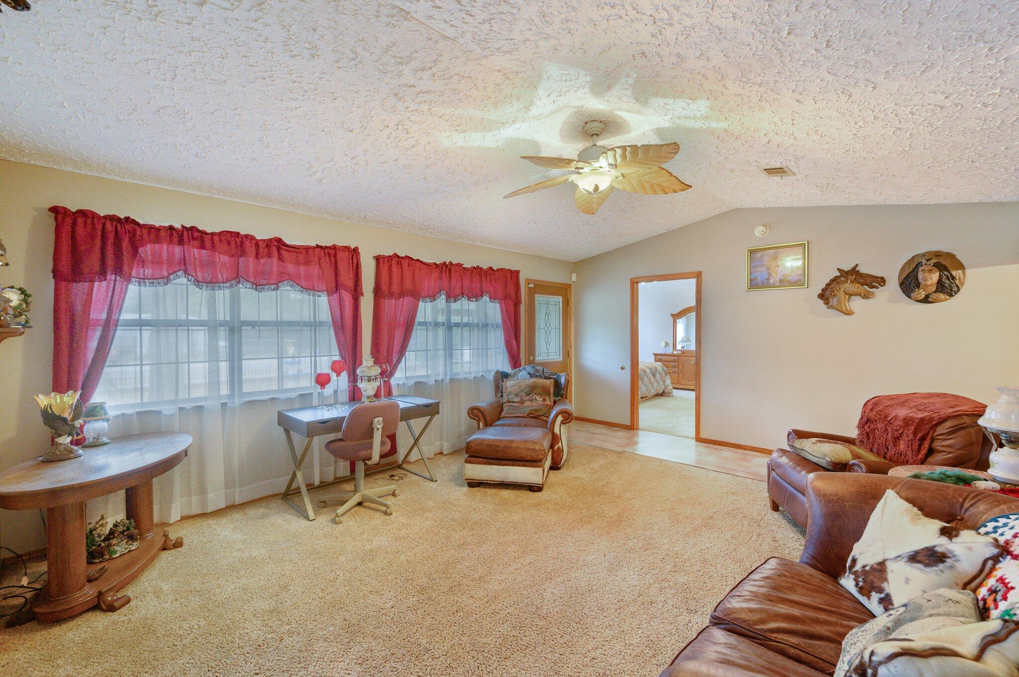 52 Tulip Avenue DeFuniak Springs, FL 32433 - Photo 5 of 34 a living room with furniture and a large window