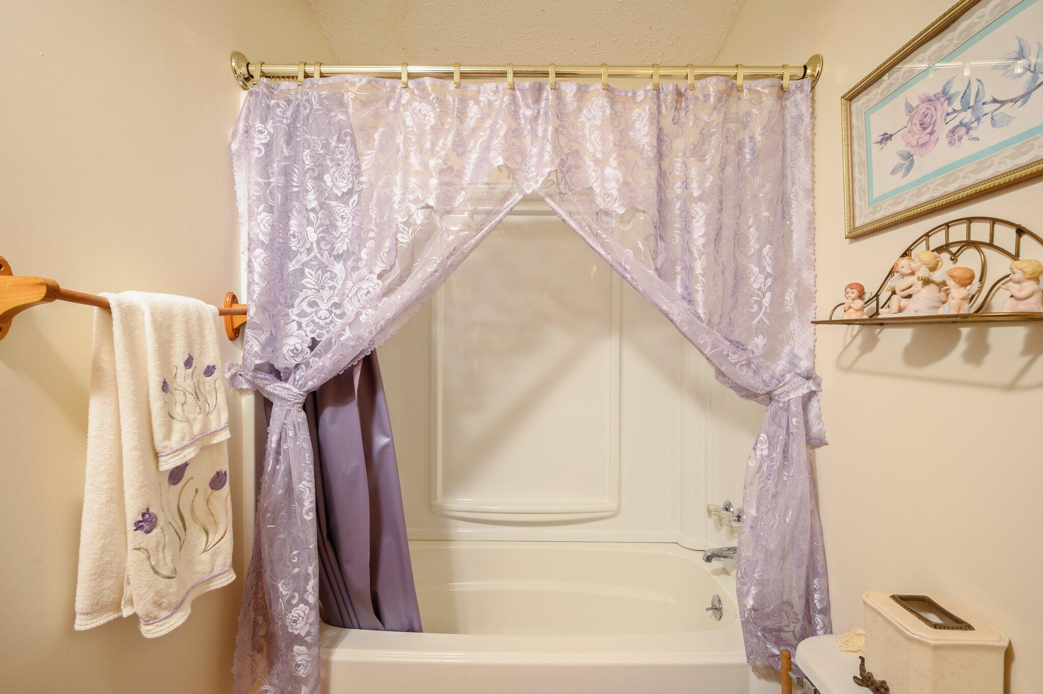 52 Tulip Avenue DeFuniak Springs, FL 32433 - Photo 9 of 34 a bathroom with a bathtub and shower