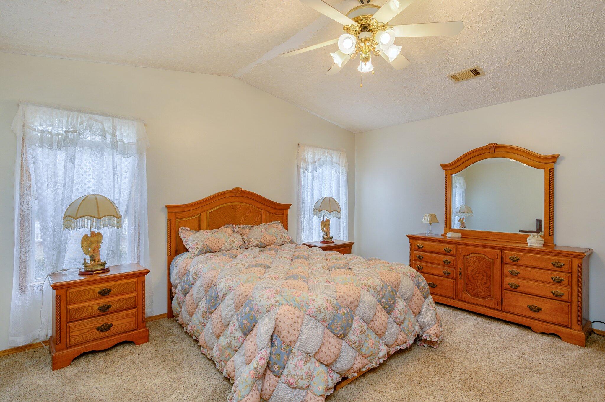 52 Tulip Avenue DeFuniak Springs, FL 32433 - Photo 10 of 34 a bedroom with a bed and a dresser