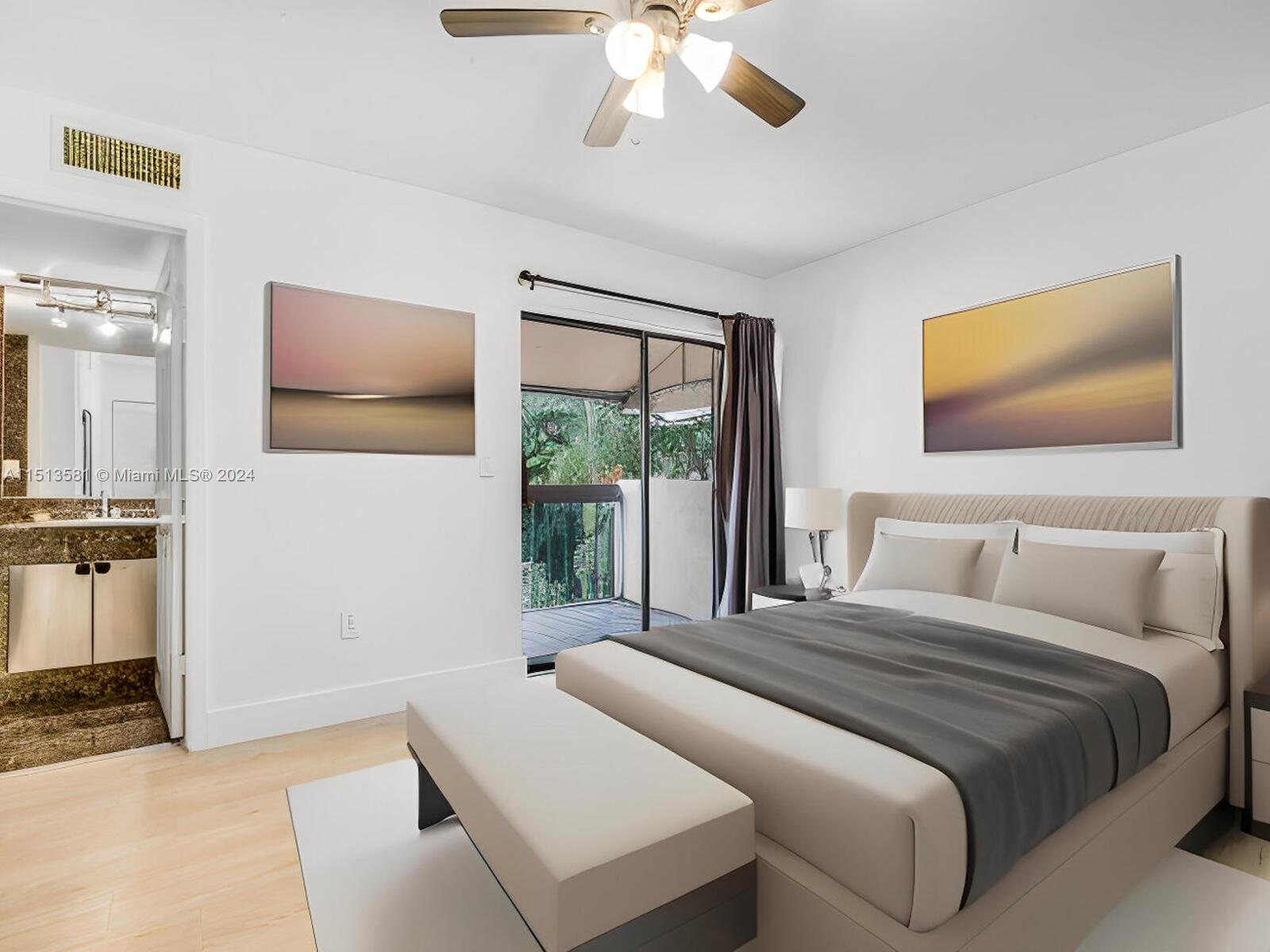2430 Brickell Avenue, Unit 105A Miami, FL 33129 - Photo 19 of 27 a bedroom with a bed and a painting on the wall