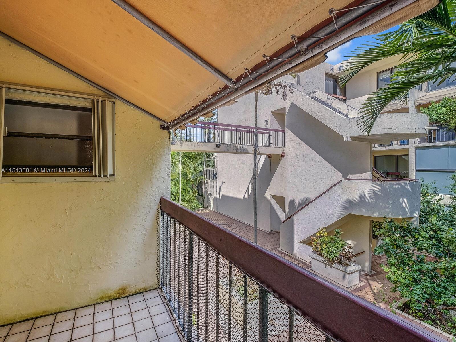 2430 Brickell Avenue, Unit 105A Miami, FL 33129 - Photo 23 of 27 a view of a house with a small yard