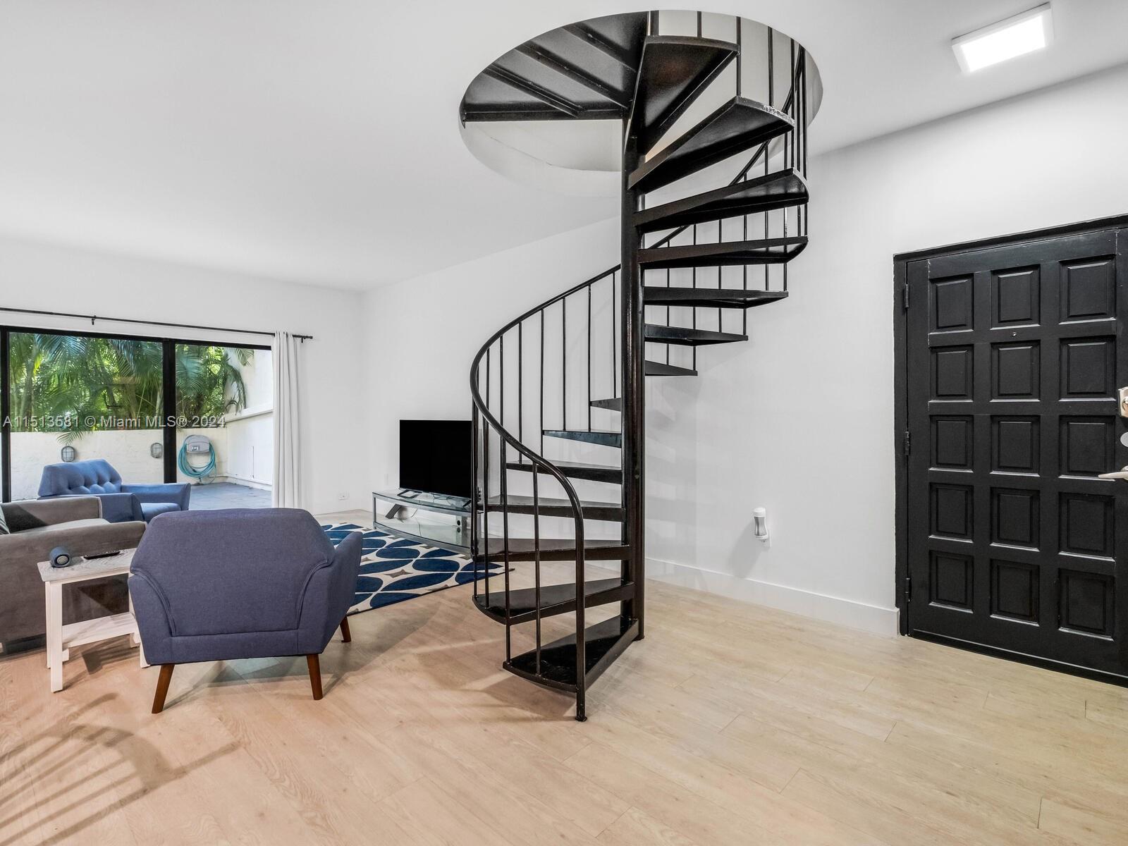 2430 Brickell Avenue, Unit 105A Miami, FL 33129 - Photo 4 of 27 a view of entryway livingroom and hall with wooden floor